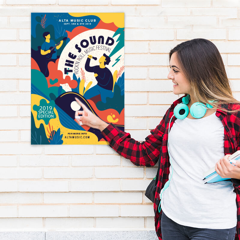 Lady pointing at poster on wall